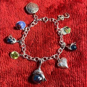 Charming Sterling Silver Bracelet with Multiple Stamped Charms
